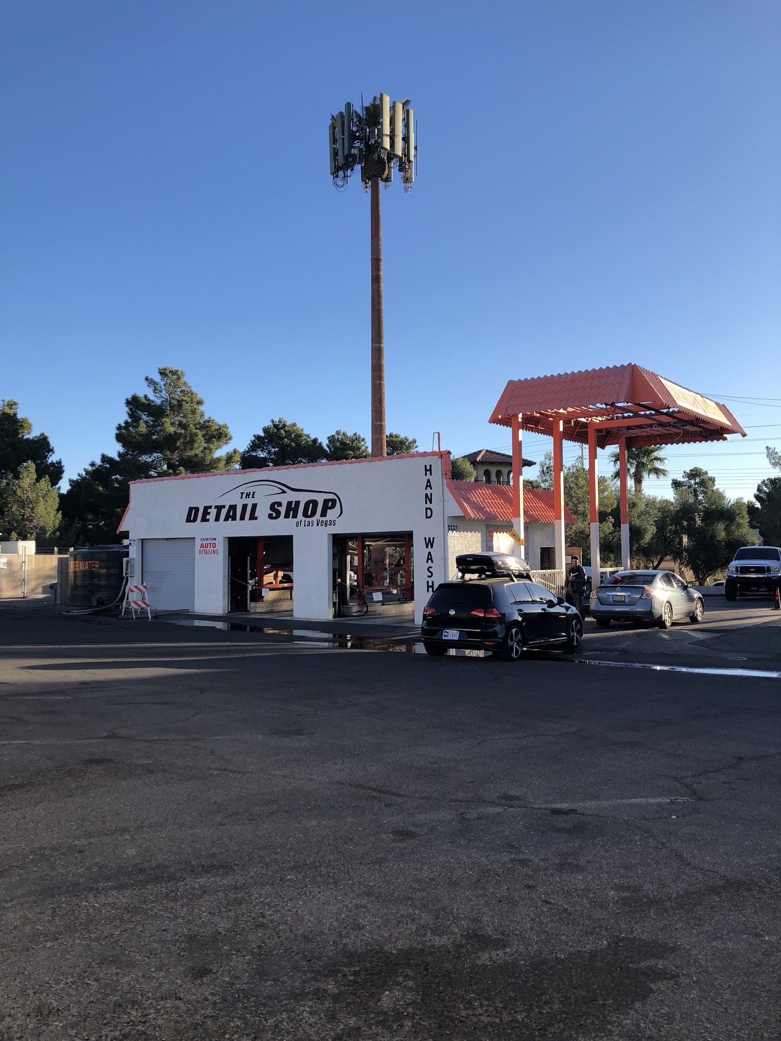 Exterior of The Detail Shop of Las Vegas with hand wash bay and cars